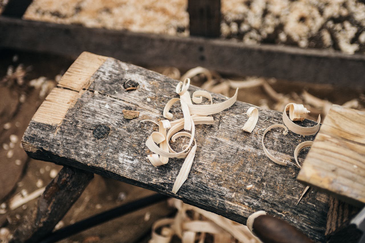 core-values Rustic workbench covered in wood shavings, showcasing detailed craftsmanship.